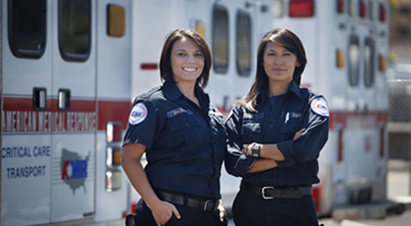 EMTs in front of Ambulance